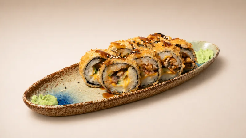 Hot Unagi roll — Eel, cucumber, cheddar slices, panko breadcrumbs, tempura, seaweed, rice