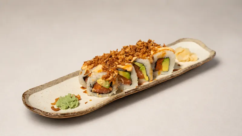 Salmon Crunch Roll — Salmon, avocado, eel sauce, spicy mayo, crunchy onion, seaweed, rice
