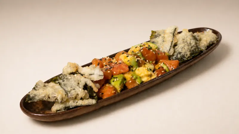 Salmon Tartare — Chopped salmon with yuzu miso, spring onion, avocado, tempura nori, sesame