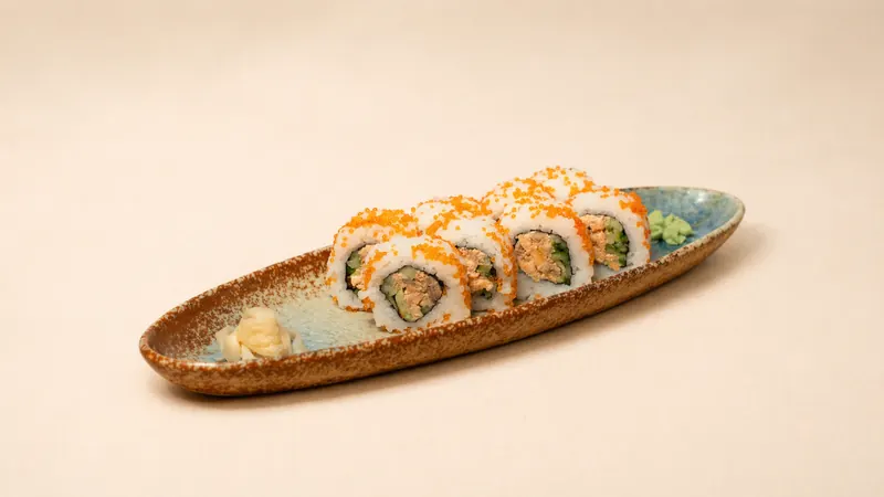 Spicy Salmon — Cooked salmon, spicy mayo, cucumber, tobiko, seaweed, rice