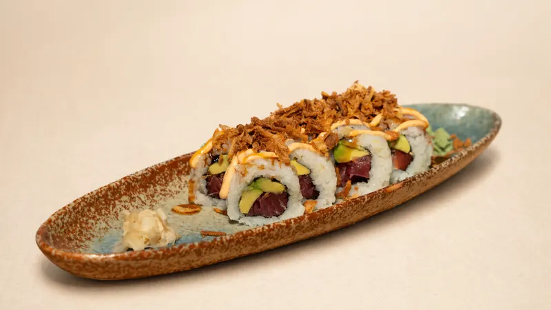 Tuna Crunch Roll — Tuna, avocado, eel sauce, spicy mayo, crunchy onion, seaweed, rice