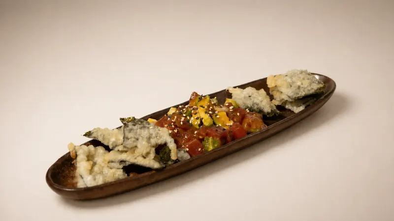 Tuna Tartare — Chopped tuna with yuzu miso, spring onion, avocado, tempura nori, sesame