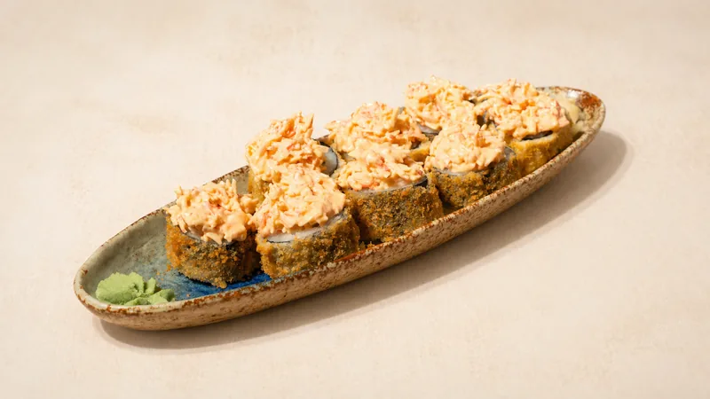 Vulcano hot roll — Crab sticks, Philadelphia, cucumber, spicy mayo, seaweed, rice